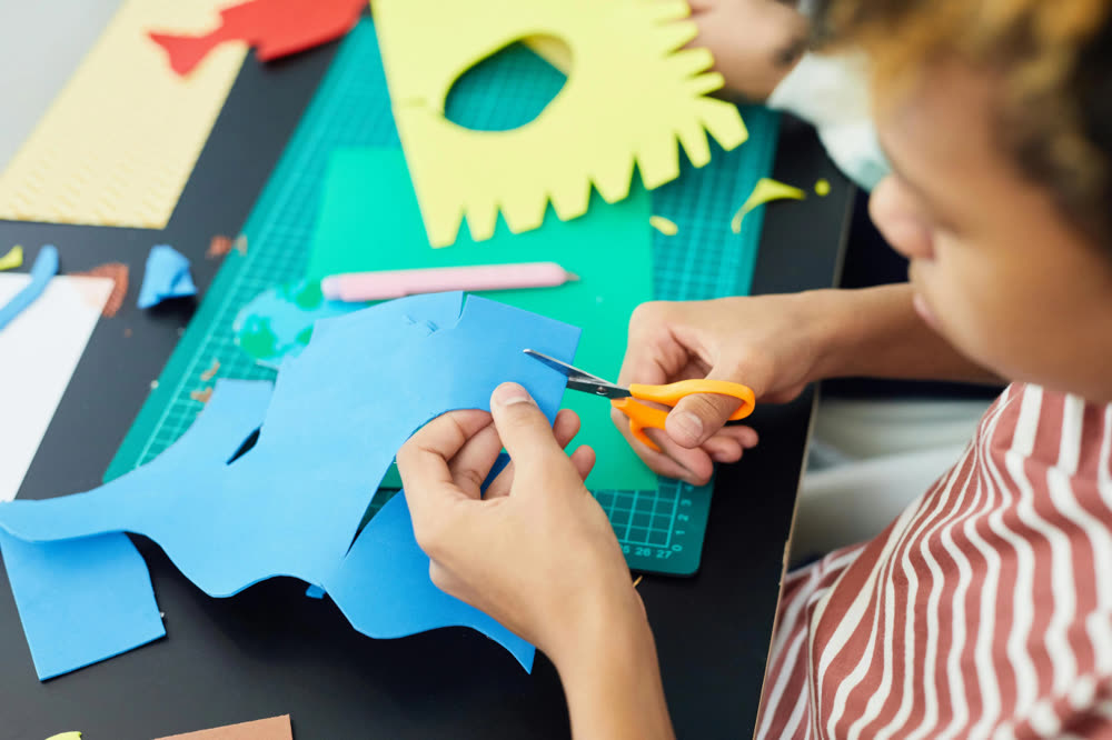 Children cutting colorful paper